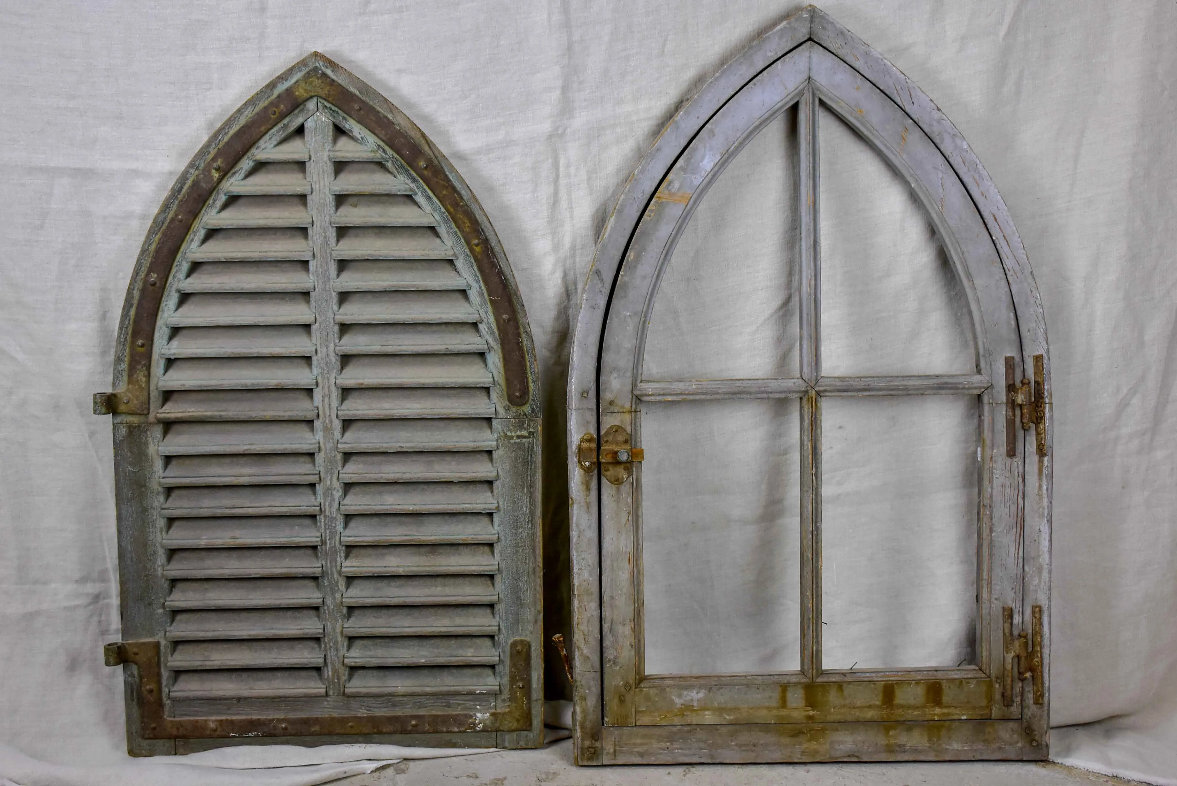 Antique French window with shutters - peaked arch