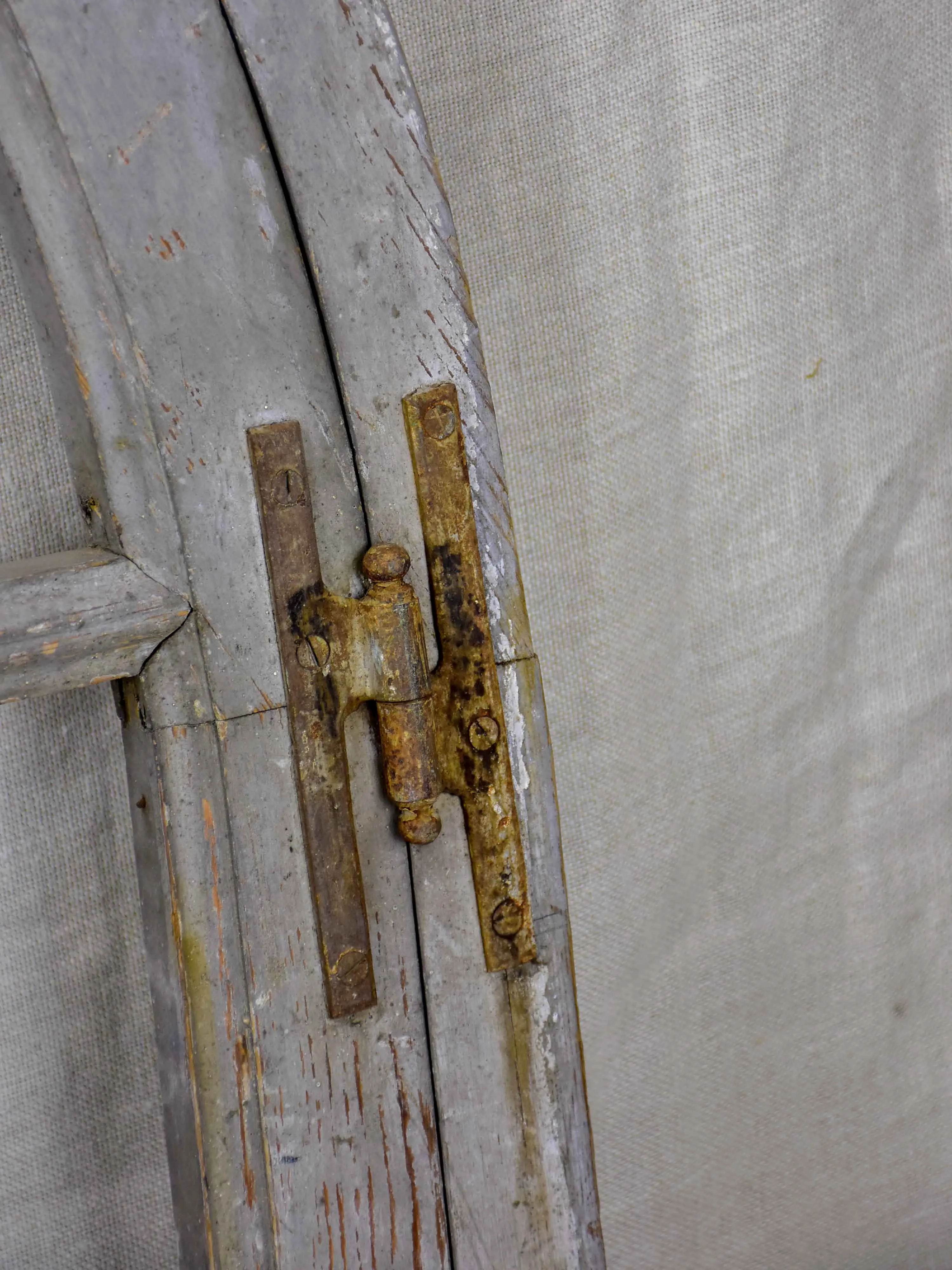 Antique French window with shutters - peaked arch