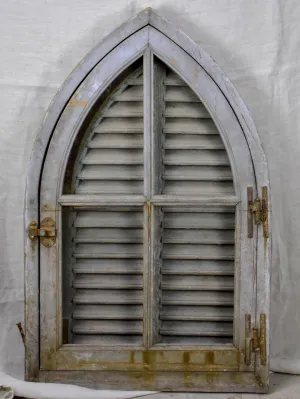 Antique French window with shutters - peaked arch