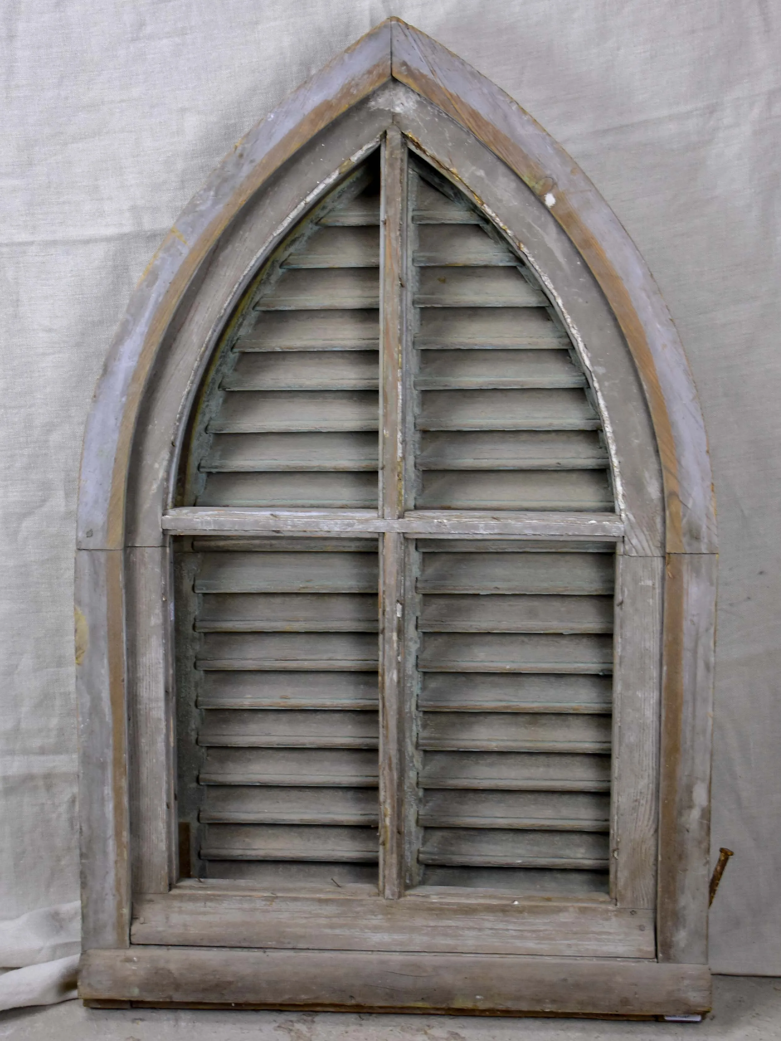 Antique French window with shutters - peaked arch