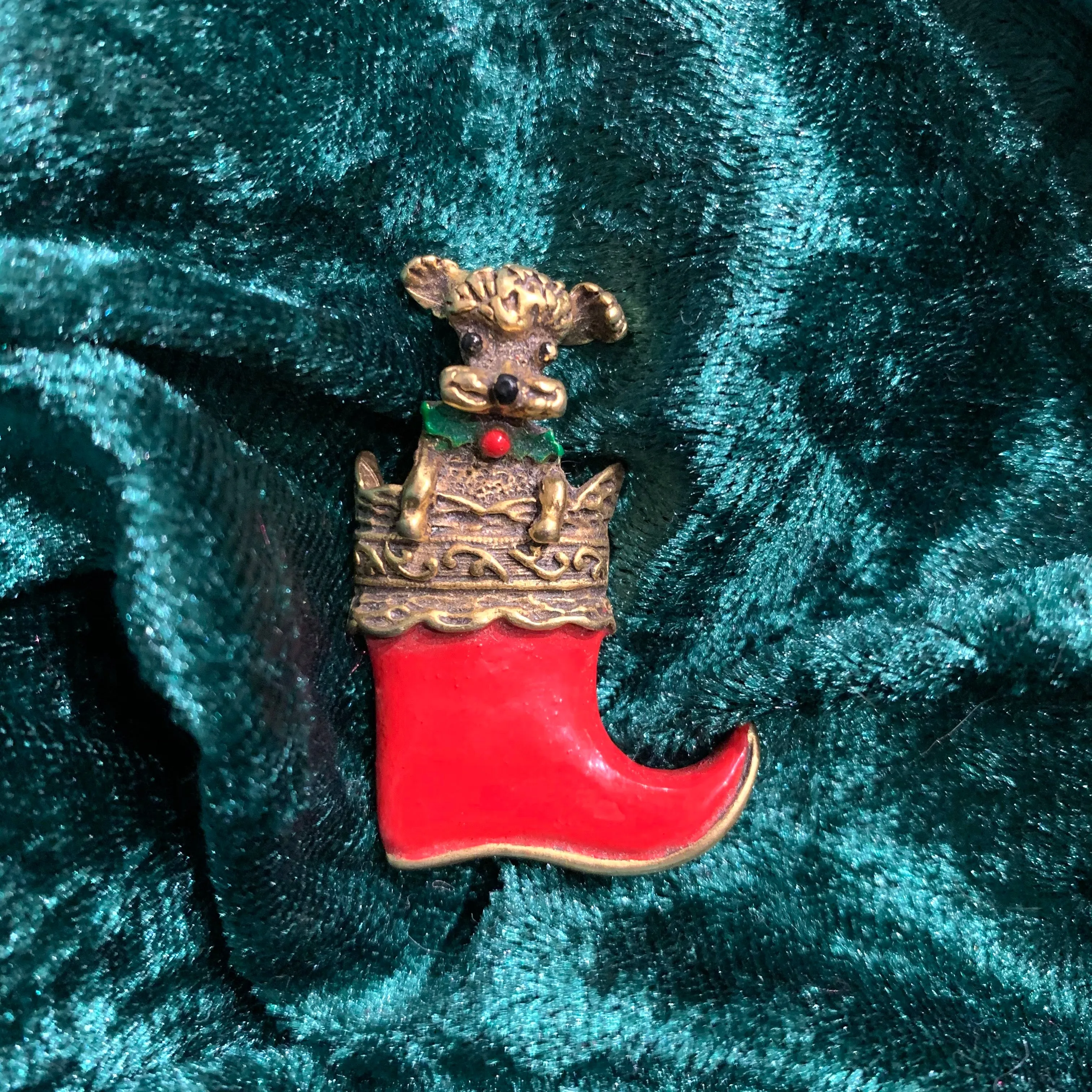 Dog in a stocking Christmas brooch by Butler and Wilson