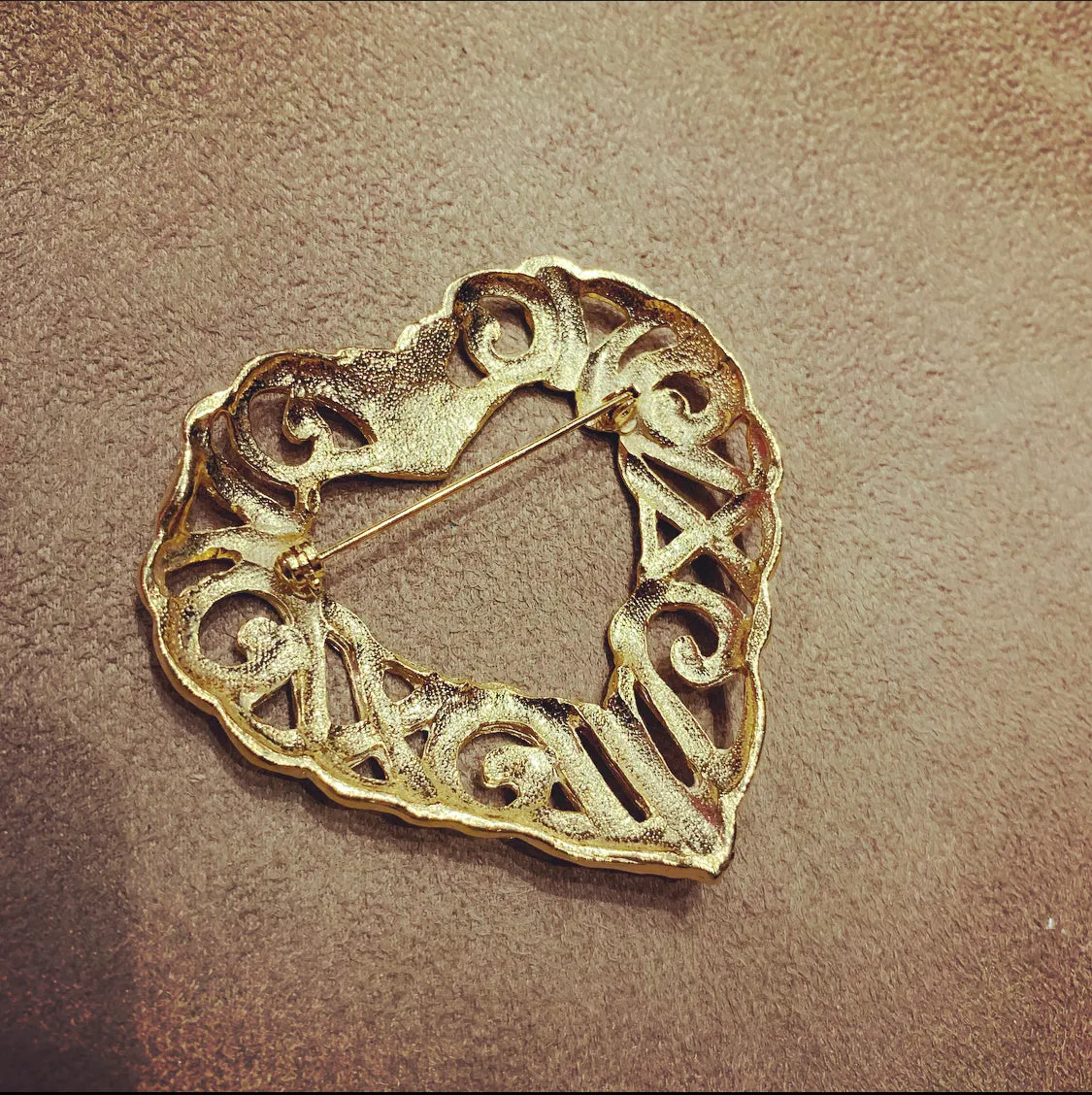 Gold filagree open heart brooch