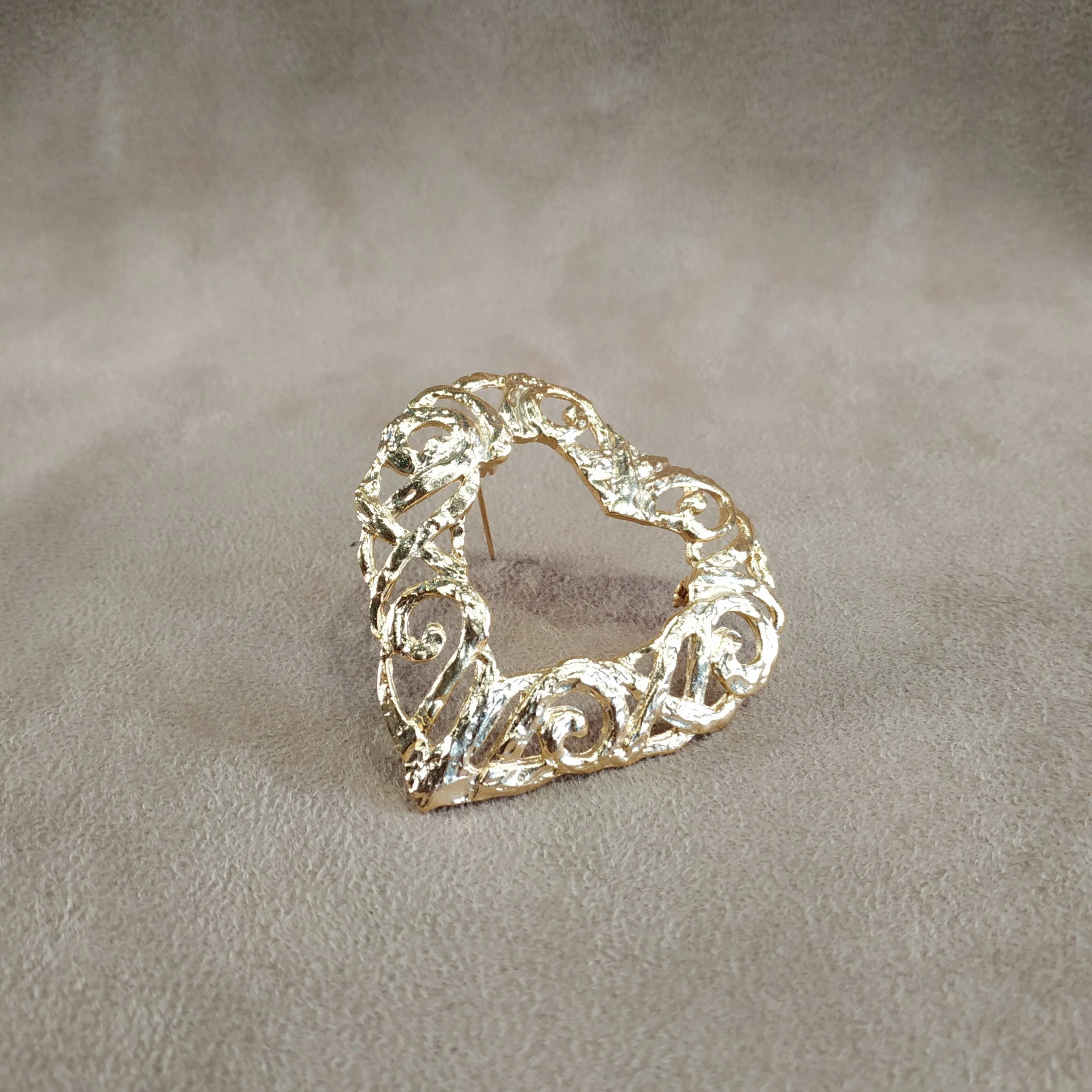 Gold filagree open heart brooch