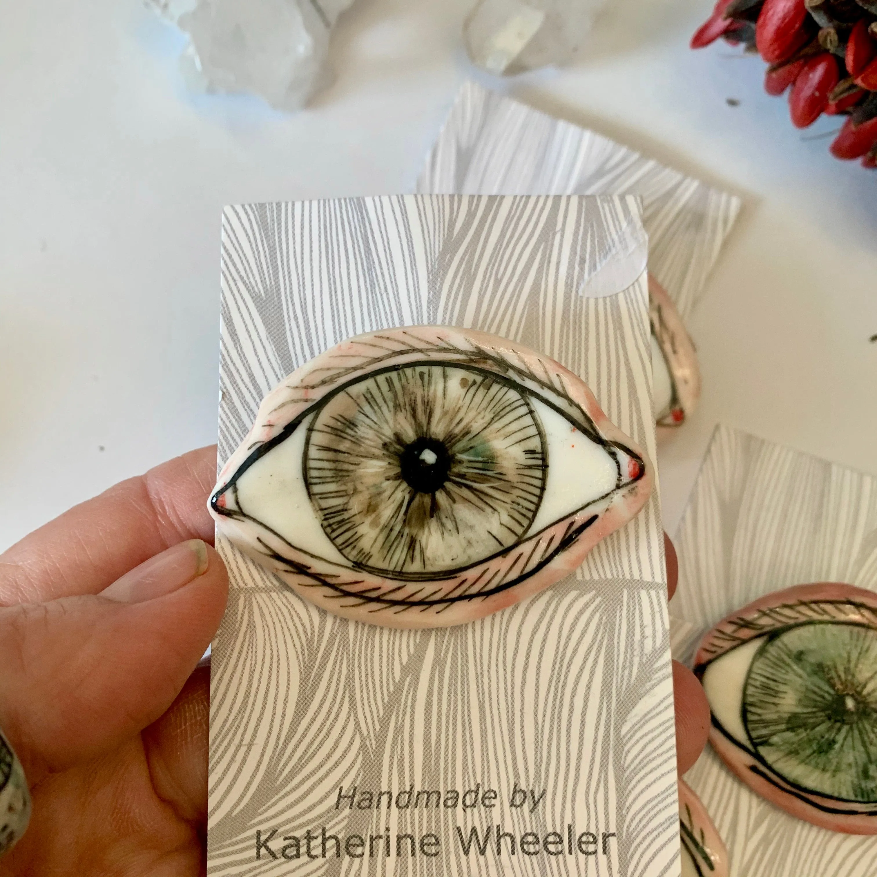 ‘The protective eye’ handpainted porcelain brooch, choose one